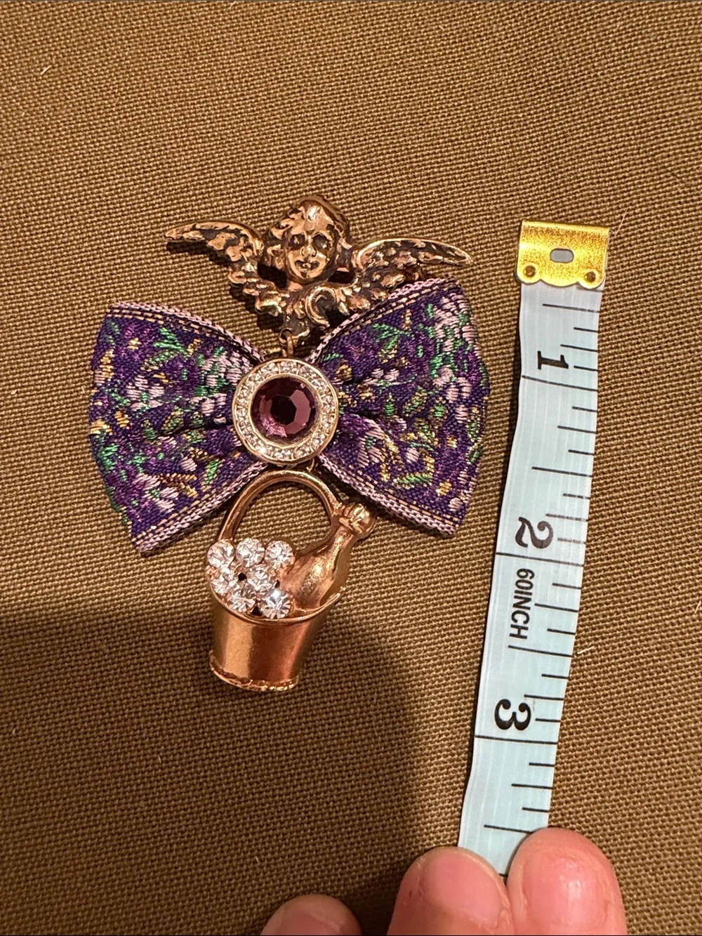 VTG Gold-Tone Cherub Bow Brooch with Purple Gem and Crystal Bucket 3 inches